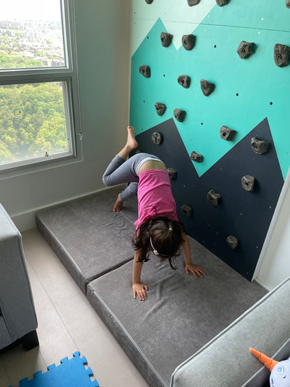 Toddler using climbing wall crash mat - Lil Boulder